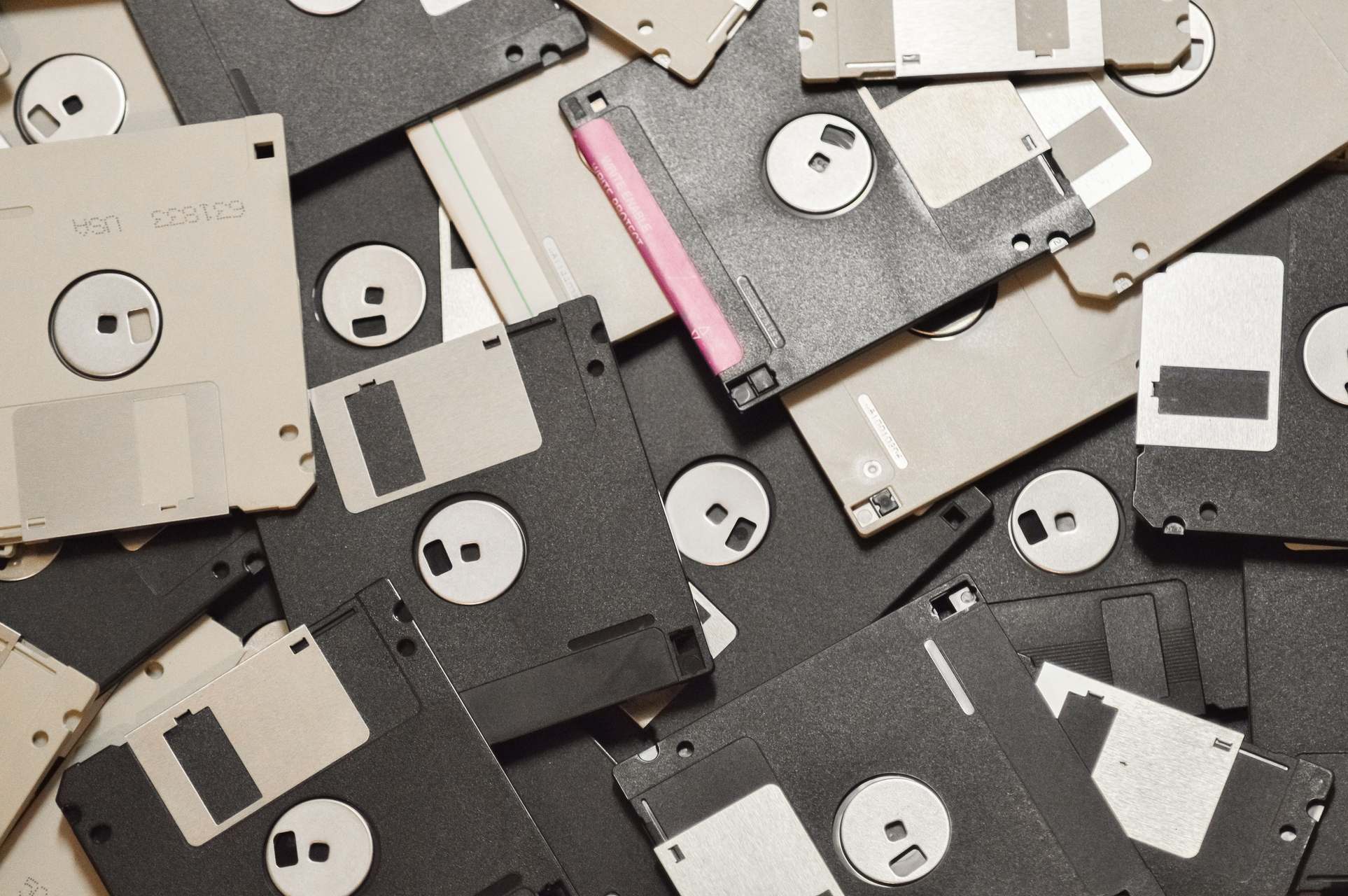 Rows of storage hardware with vintage floppy disks